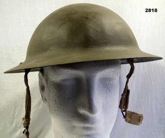 Green coloured steel helmet British pattern.