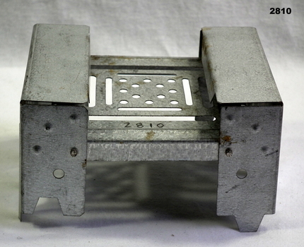 Metal folding hexamine cooking stove.