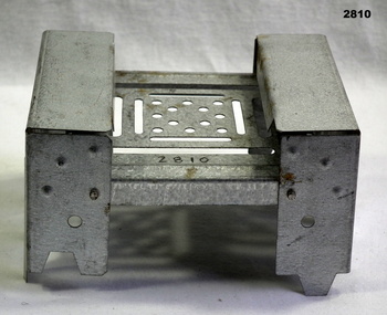 Metal folding hexamine cooking stove.
