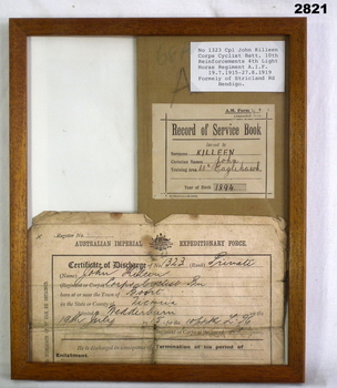 Discharge certificate, service book framed WW1.