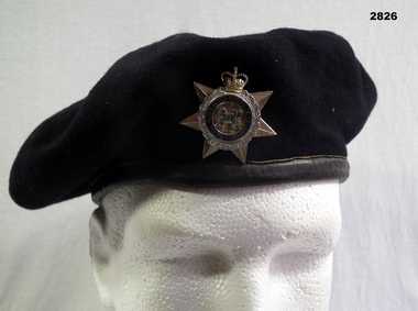 Black beret with Transport Corp badge.