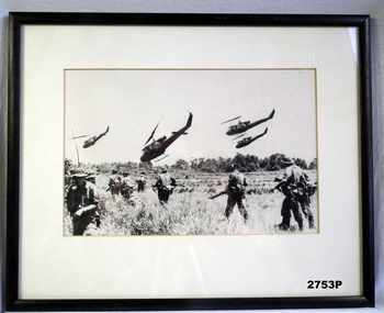 B & W Photo showing troops and helicopters Vietnam.
