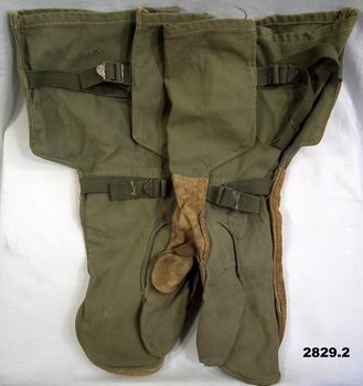 Pair of green canvas arm gauntlets.