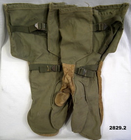 Pair of green canvas arm gauntlets.