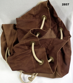 Brown kit bag with rope pull close.