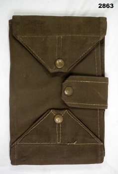 Folding dark colour canvas map case.