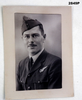 B & W photo on card re portrait of an Airman.