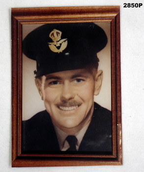 Colour portrait of an Airman framed.
