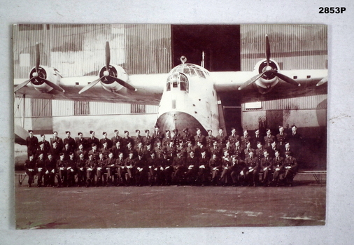 photograph with Airmen in front of a Sunderland Aircraft.