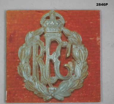 Photograph of laurel surround with the letters “RFC”.