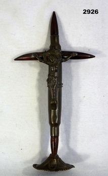 Small cross made from cartridges and sculpture.