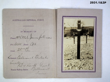 Photographs and memorial of a soldiers grave.