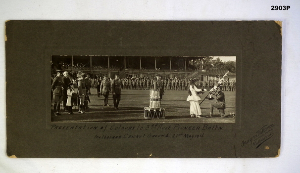 Photograph showing presentation of unit colours WW1.