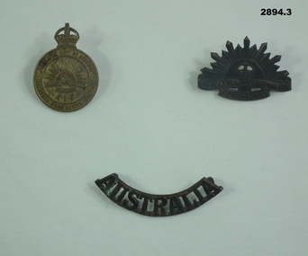 Three badges, uniform and association.