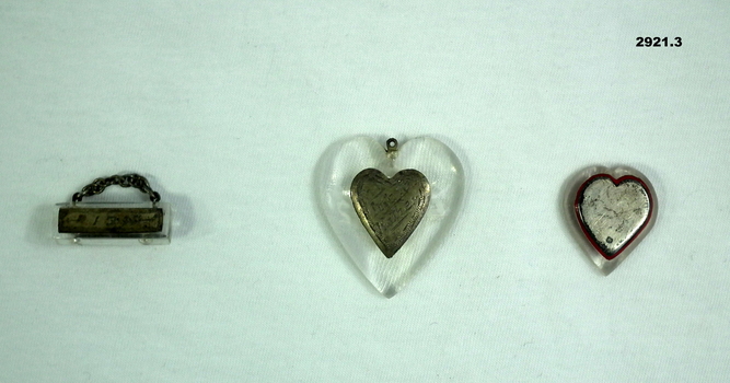 Three badges relating to personal.