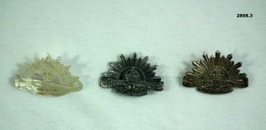 Three Rising sun lapel badges, one Perspex.