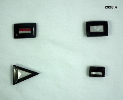 Four badges representing unit associations.