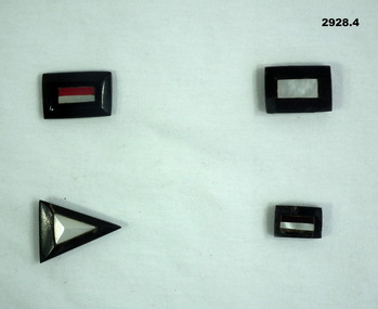 Four badges representing unit associations.
