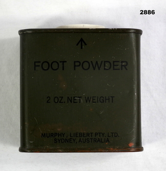 Green coloured foot powder tin.