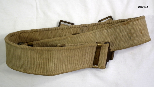 Three webbing belts, black, green, khaki.