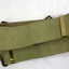 Three webbing belts, green, black, khaki.