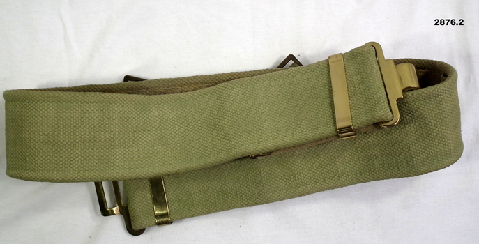 Three webbing belts, green, black, khaki.