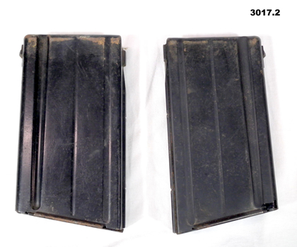 Two black SLR  rifle magazines.