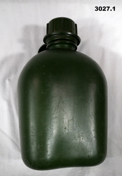 Three green colour plastic water bottles.