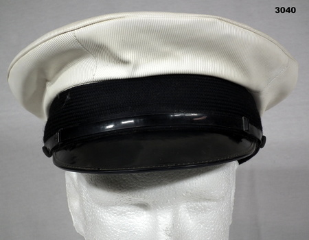 Peaked hat RAN white and black colours.