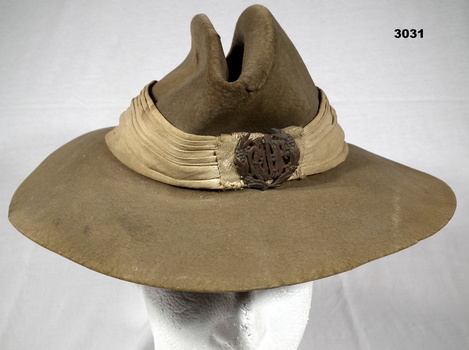 Khaki slouch hat with RAAF badge on.