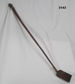 Riding crop with Rising sun badge on.