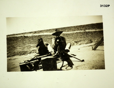 Photograph showing two soldiers with a Vickers M/Gun.