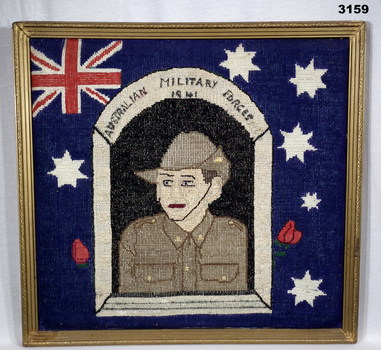 Tapestry showing the flag with soldier in centre.