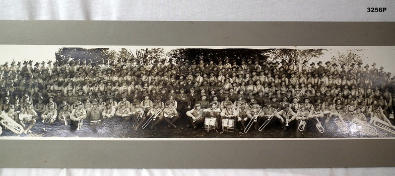 Large group photo of soldiers with bandsmen.