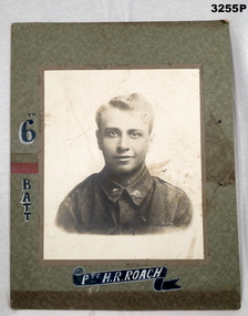 B & W portrait with name, unit of WW1 soldier.