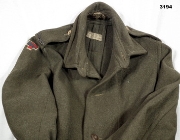 Great coat with colour patch on.