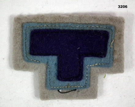 Letter T colour patch denoting Tobruk.