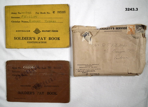 Two soldiers pay books from WW2