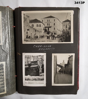 Page in a small red covered album.