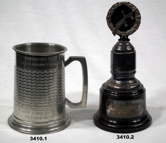 Tankard and trophy given to G Murray.