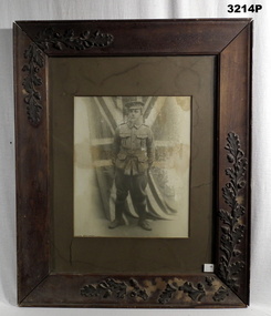 Full portrait of a WW1 soldier with flag.