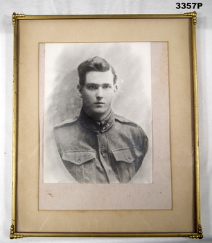 Framed B & W portrait of a WW1 soldier.