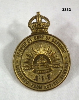 Brass badge, retuned from Active service.
