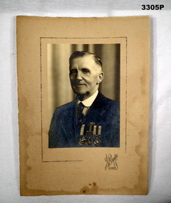 Photograph showing civilian with medals on.