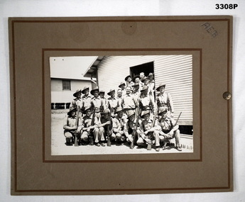 Group of Australian soldiers outside a hut