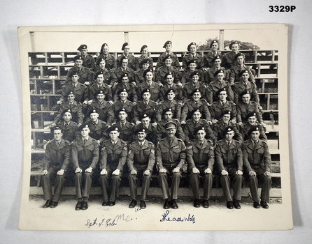 Photograph showing group of soldiers sitting.