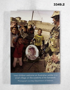 Badge on card re service in Iraq.