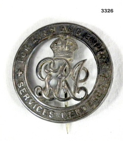 Round silver badge re services rendered.