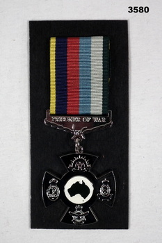 Australian POW medal with ribbon on card