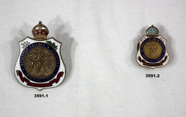 Two RSL membership badges, 1 large, 1 small.